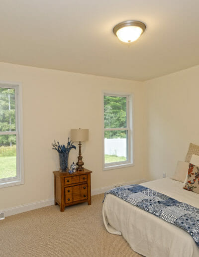 bedroom with a queen size bed and new carpet