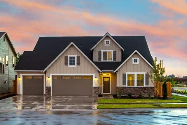 Brown and gray painted house in front of the road