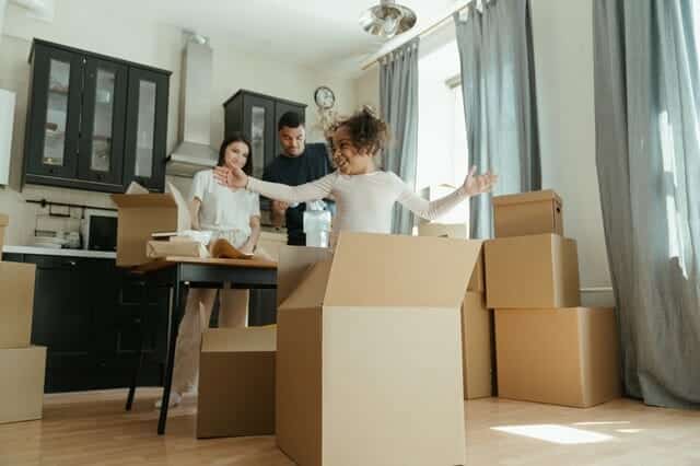 Family preparing for moving after being able to buy and sell a house at the same time