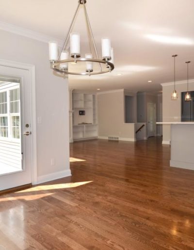 open concept kitchen, dining, and living areas in a modern, new construction house