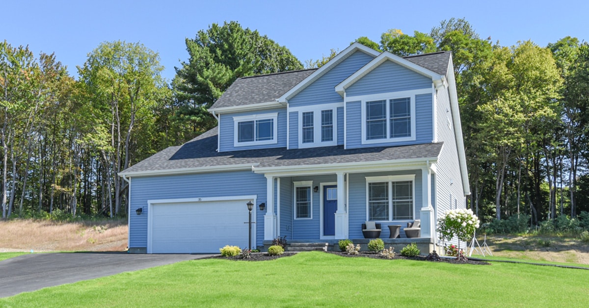 2 story house with blue siding and white trim