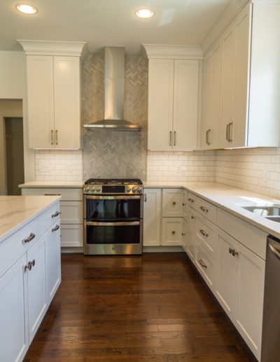 white kitchen with tile backsplash