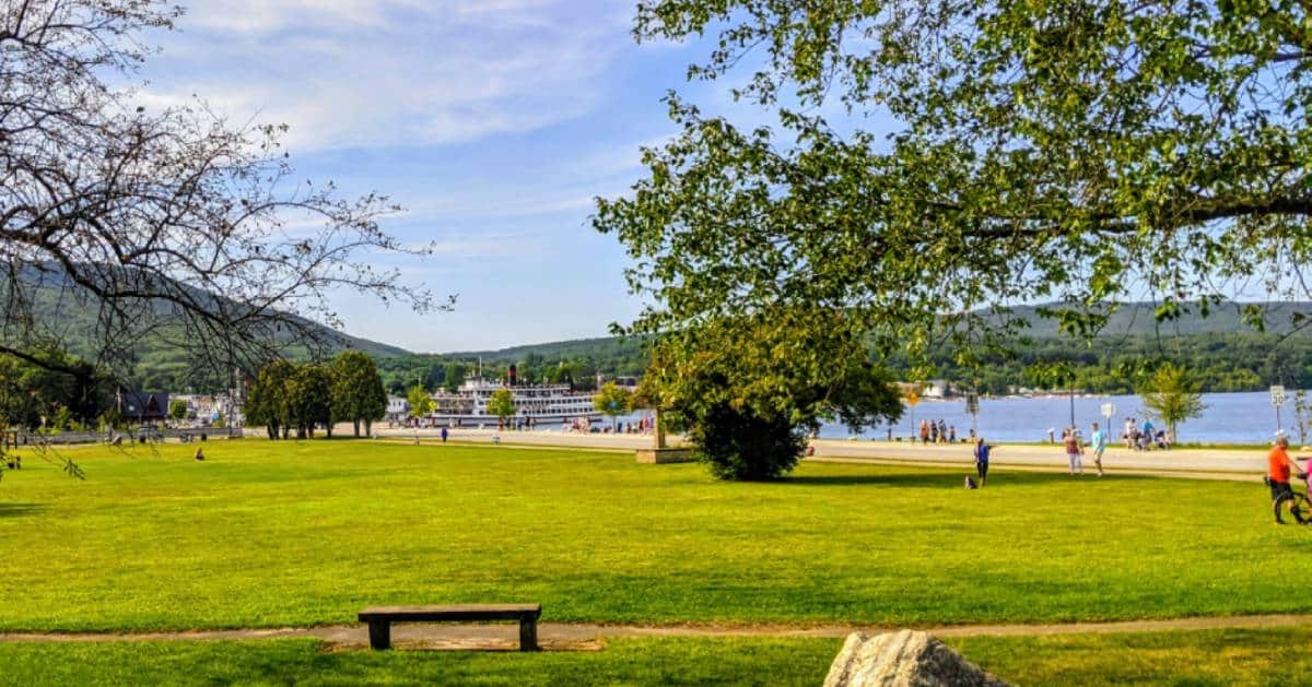 park and lake with cruise ship