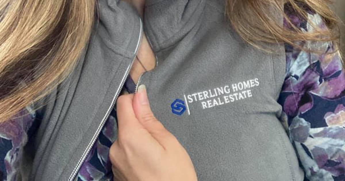 closeup of Sterling Real Estate Group vest