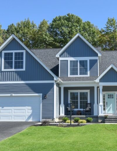 2 story blue home with white trim