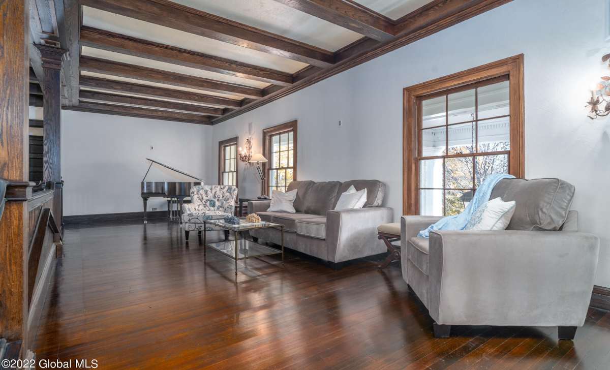 piano room in a house with chairs