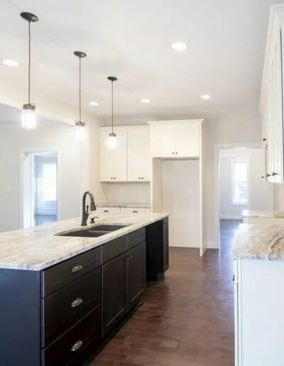 kitchen with dark cabinets and white quartz counters