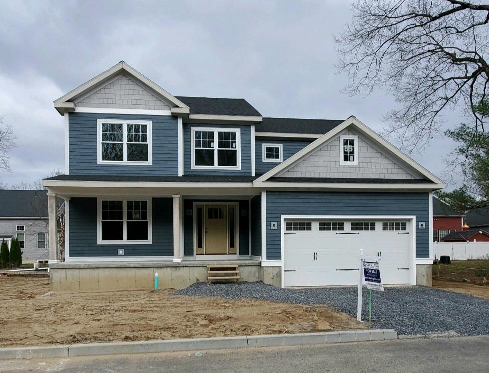 2 story home with blue siding and white trim