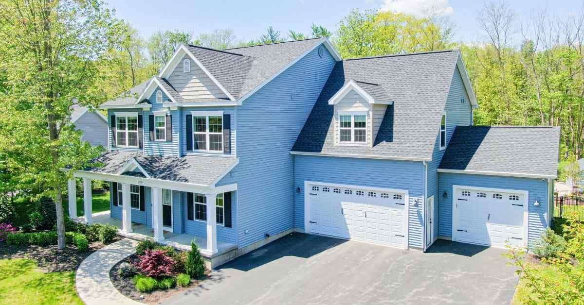 exterior of a large light blue house