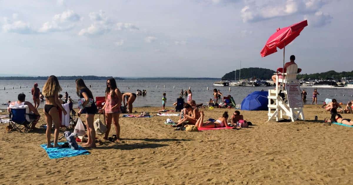 people on a lake beach